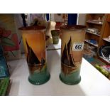 A pair of pottery vases decorated with sailing ships (20cm high)