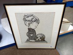 A framed tapestry of a boy with dog (48cm x 52cm)