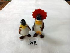 Two Beswick penguins.