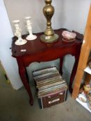 A red lacquered tea table with 2 slide out shelves