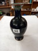 A Doulton Slaters patent 9.5" high vase with narrow neck. Dark blue with star patterns and a panel