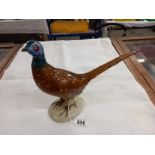 A Royal Dux hand painted pheasant, 10" high and 12" long, made in Czechoslovakia, with pink dating