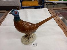 A Royal Dux hand painted pheasant, 10" high and 12" long, made in Czechoslovakia, with pink dating