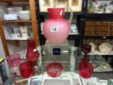 An overlaid pink glass jug & 6 pieces of cranberry glass