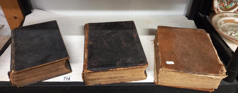 Three old family Bibles.