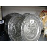A quantity of German metal wall plaques.
