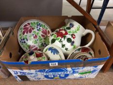 A floral pottery jug & other items including plates