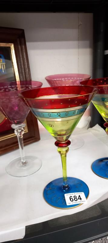 Four cocktail glasses.