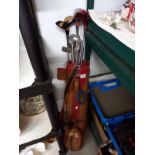 A vintage golf bag and clubs,