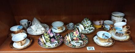 A selection of china cups & saucers including Royal Albert