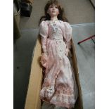 A 38" tall porcelain headed collector's doll (one shoe a/f)