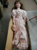 A 38" tall porcelain headed collector's doll (one shoe a/f)