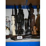 A quantity of carved wood tribal figures.