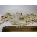A mixed lot of Chinese bone counters, cigarette holders and man with cart.
