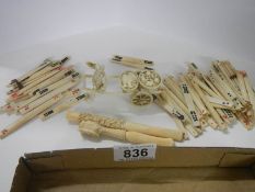 A mixed lot of Chinese bone counters, cigarette holders and man with cart.