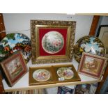 A mixed lot including framed pot lids, plates etc.,