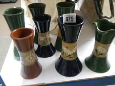 A quantity of Langley ware vases.