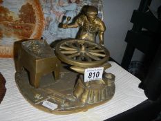 A heavy brass Blacksmith figure.