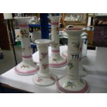 A quantity of ceramic candlesticks.