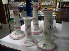 A quantity of ceramic candlesticks.