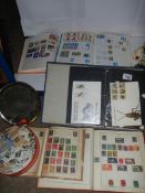 A mixed lot of stamp albums and stamps.