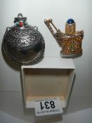 Two small perfume bottles.