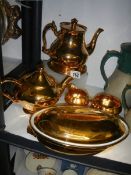 A Royal Winton Grimwades three piece tea set, another teapot and a tureen.