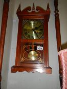 A mid 20th century spring wind wall clock in working order. COLLECT ONLY.
