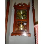 A mid 20th century spring wind wall clock in working order. COLLECT ONLY.