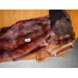 A quantity of fur stoles.