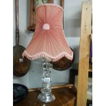 A late 20th century acrylic table lamp with early shade.