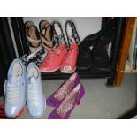 A mixed lot of ladies shoes.