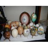 A mixed lot of decorated eggs, boxes etc.,