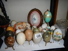 A mixed lot of decorated eggs, boxes etc.,