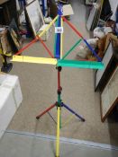 A multi coloured folding music stand.