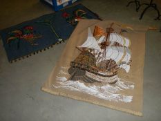A ship wall hanging and one other.