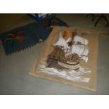 A ship wall hanging and one other.