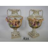 A good pair of small hand painted embossed vases.