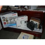 A Janome sewing machine, radios etc.,