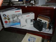 A Janome sewing machine, radios etc.,