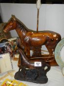 A horse table lamp and a horse figure.