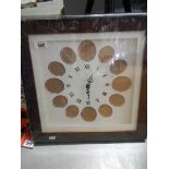 A good quality clock / picture framed for 12 pictures