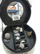 A quantity of good dress rings in a jewellery box.