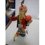 A mid 20th century battery operated clown.