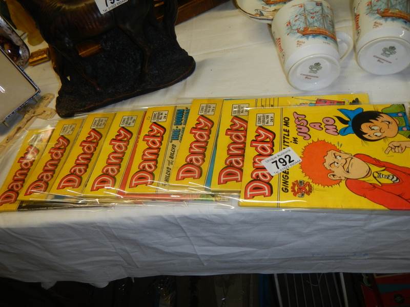 Eight copies of 'The Dandy Comic Library'.