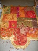 An old patchwork wall hanging.