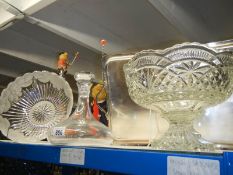 A glass decanter and two glass bowls.