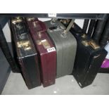 Three brief cases and a vanity case.