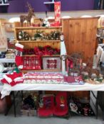 A large lot quantity of miscellaneous Christmas items including hats, stockings, wreaths &