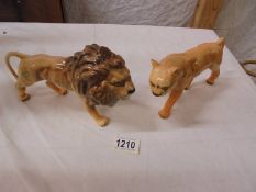 A Beswick lion and lioness.